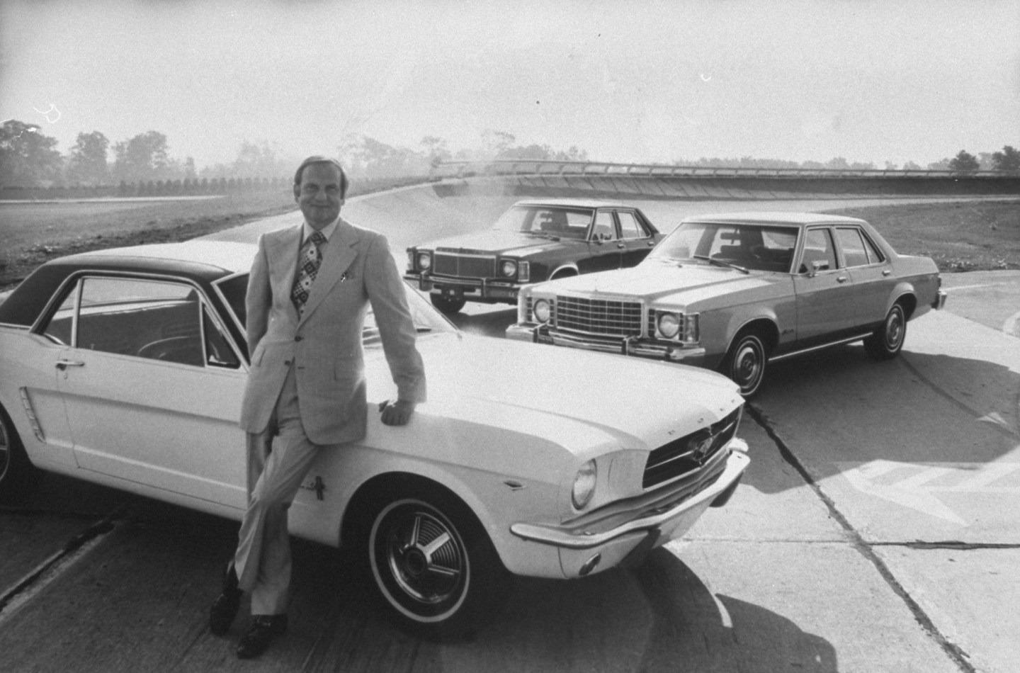 Ford Motor Co. president Lee A. Iacocca, leaning against a Ford Mustang in January 1974.