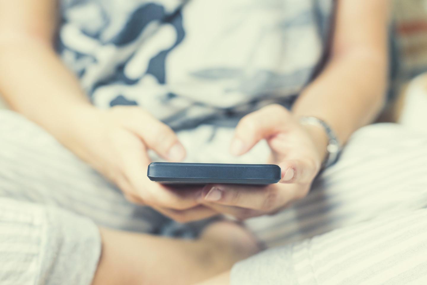 Teenage girl using a smart phone
