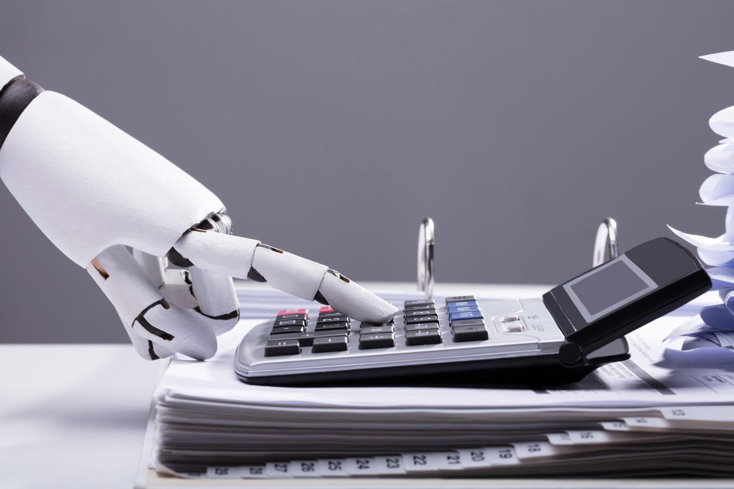 Robotic Hand Using Calculator In Office