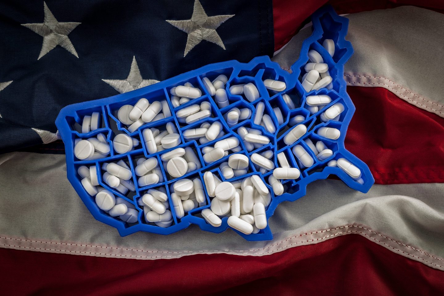 American map covered with opioid painkillers like oxycodone and hydrocodone