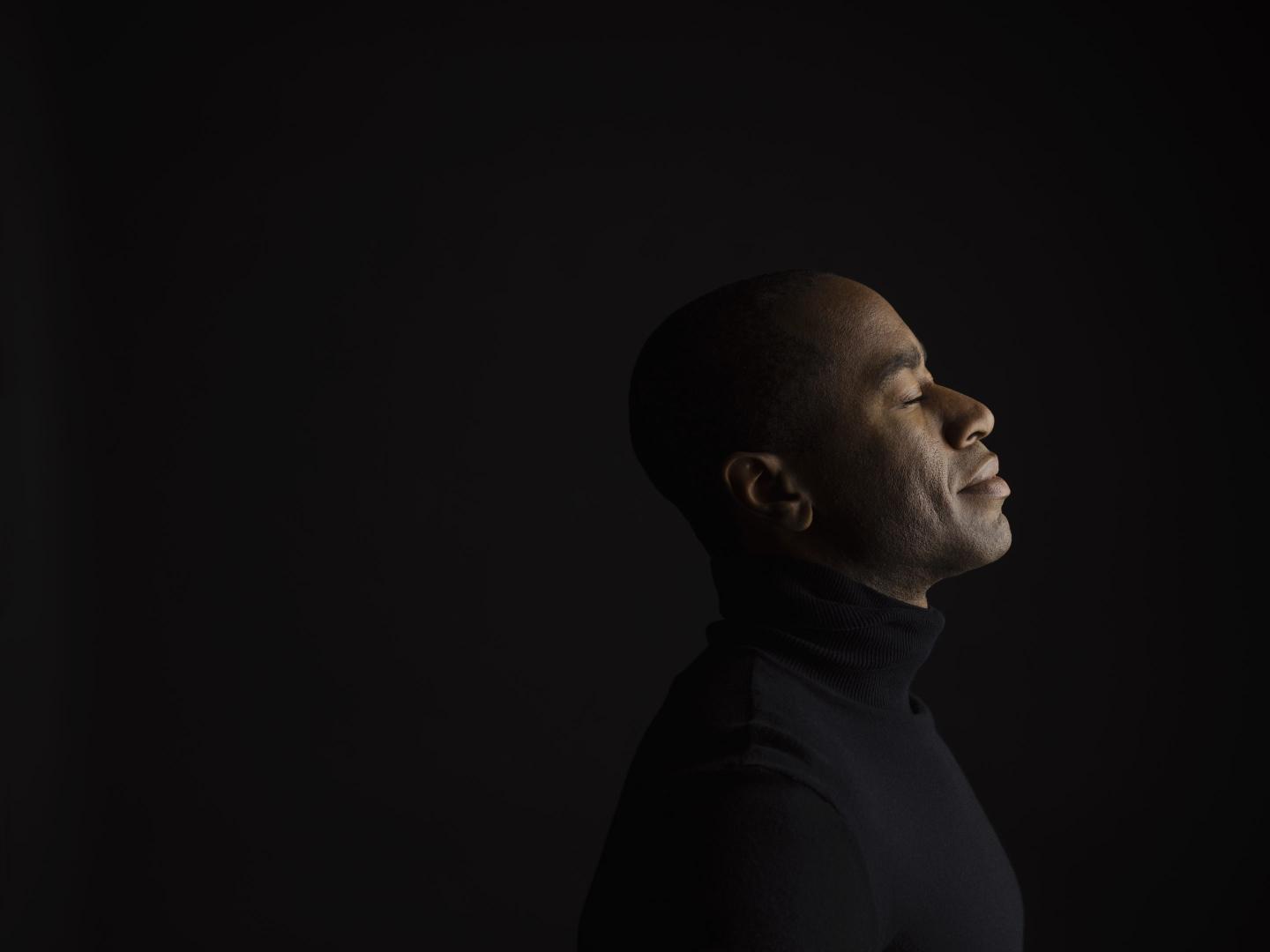 profile of calm man meditating