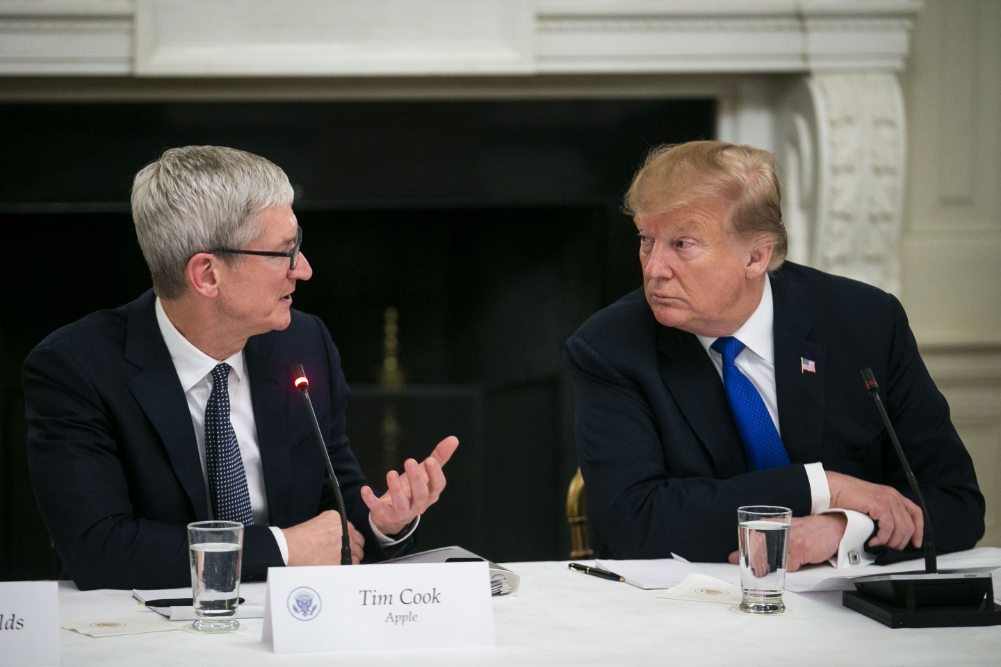 Tim Cook, chief executive of Apple, speaks with President Donald Trump during an American Workforce Policy Advisory board meeting in March.