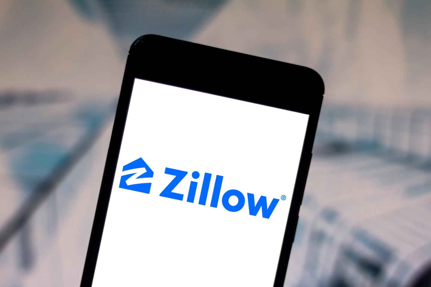 Why did Zillow get out of the house flipping business?