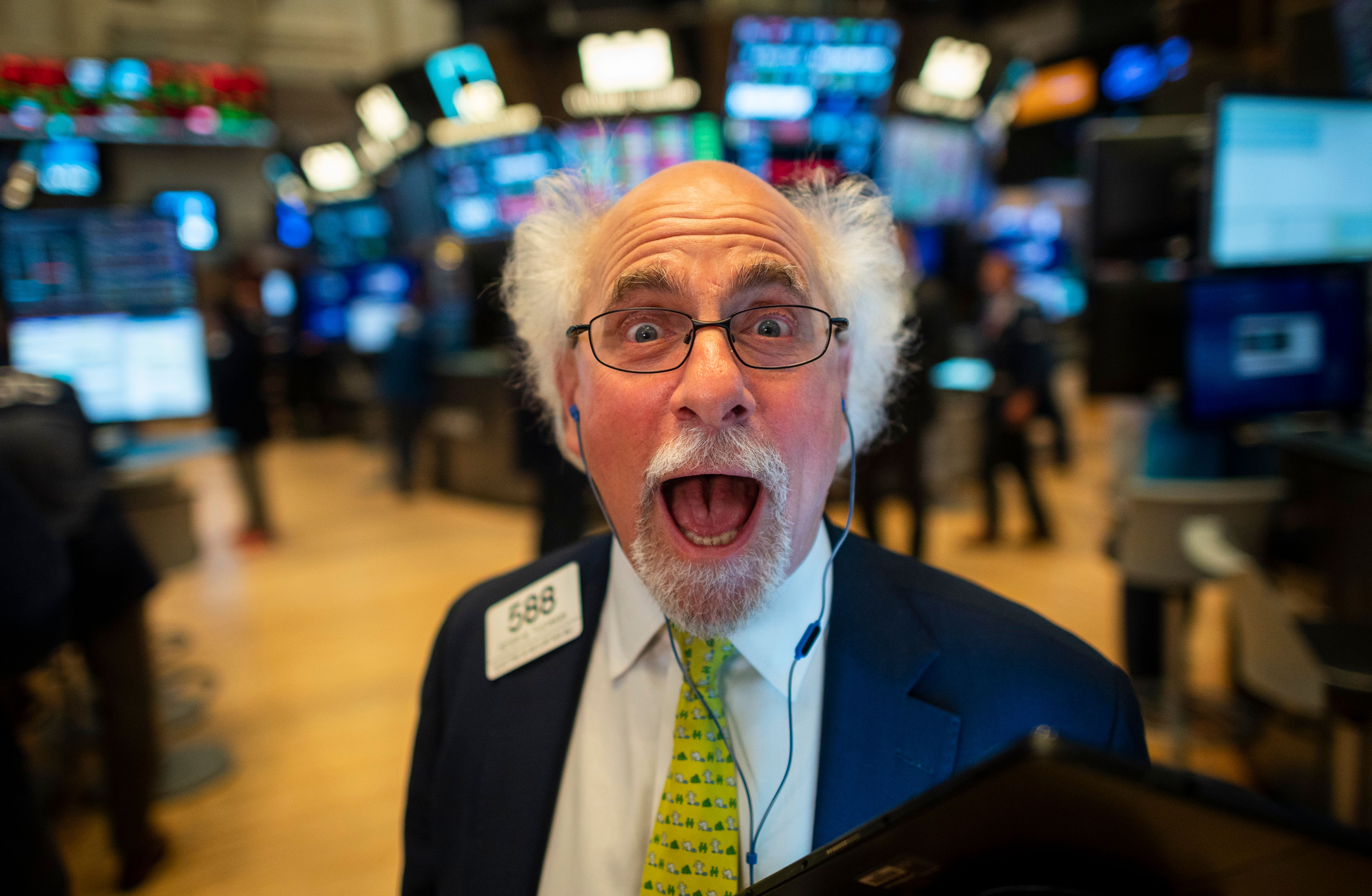 Open-mouthed trader jokes at New York Stock Exchange