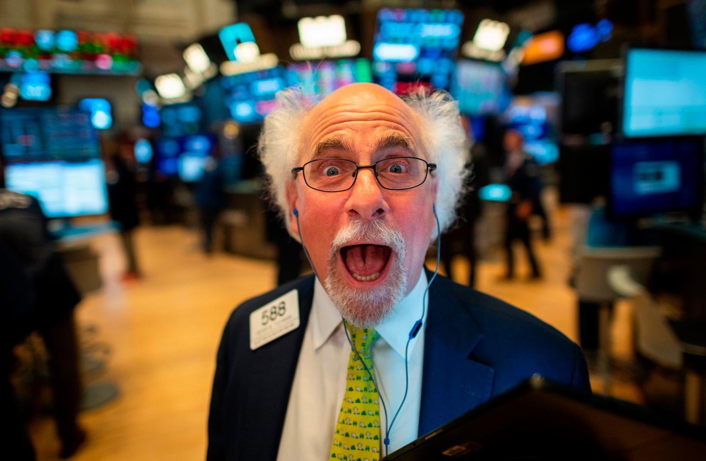 Open-mouthed trader jokes at New York Stock Exchange