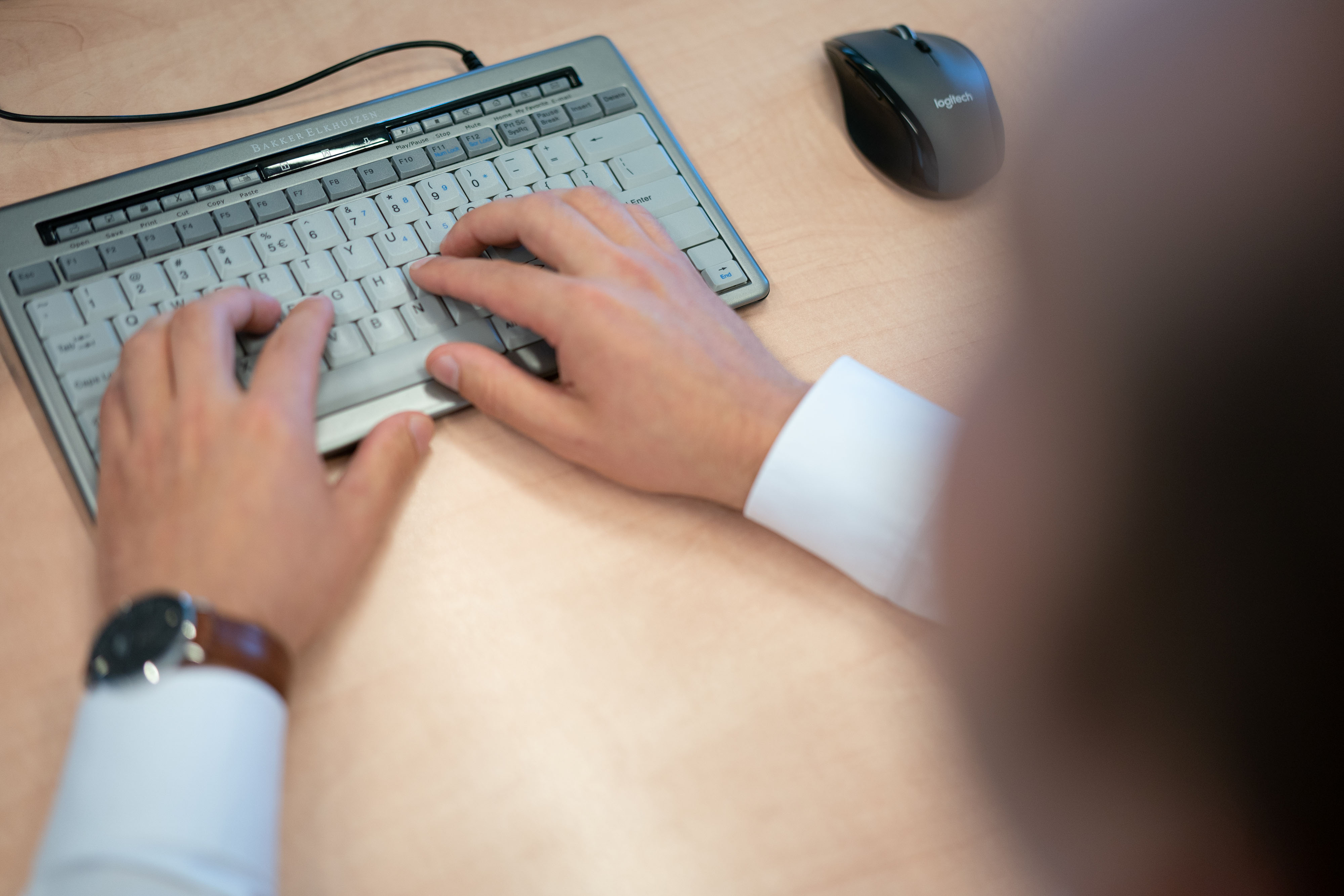 hands on a computer keyboard
