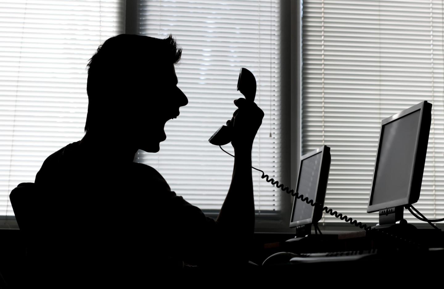 Man yelling into phone