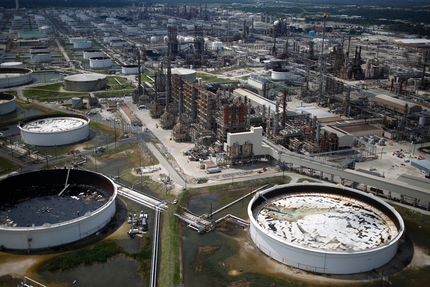 Flooded oil refinery storage tanks and petrochemical refineries stand in this aerial photograph taken above Texas City, Texas, U.S., on Wednesday, Aug. 30, 2017.