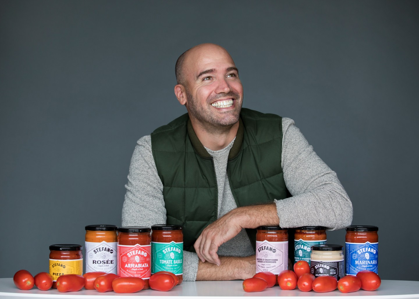 Stefano Faita poses with eight out of ten of Stefano Sauce options.