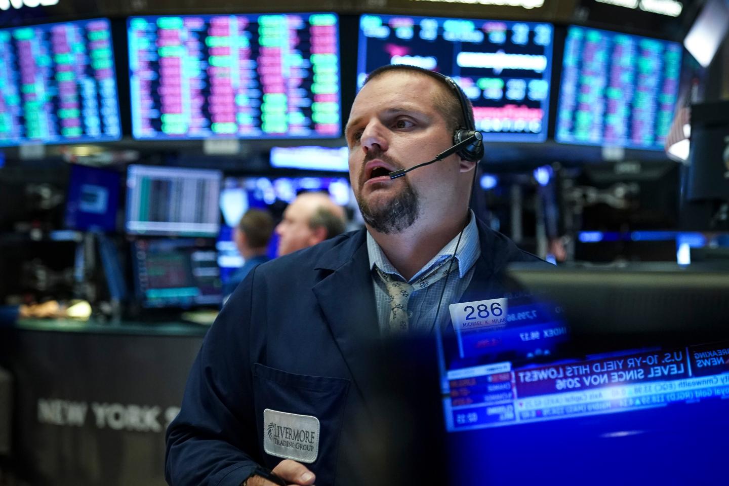NEW YORK, NY - AUGUST 1: Traders and financial professionals work ahead of the closing bell on the floor of the New York Stock Exchange (NYSE) on August 1, 2019 in New York City. Following large gains earlier in the day, U.S. markets dropped sharply after an afternoon tweet by U.S. President Donald Trump announcing his plans to impose a 10 percent tariff on an additional $300 billion worth of Chinese imports. His announcement said the new tariffs will take effect on September 1. (Photo by Drew Angerer/Getty Images)