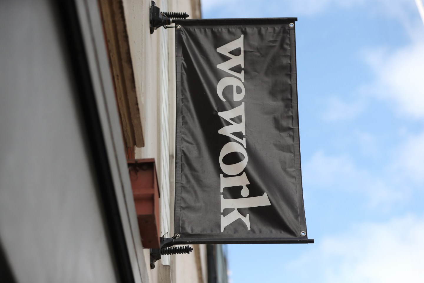Signage outside the co-working office space group, WeWork, at Chapel Street, London. (Photo by Jonathan Brady/PA Images via Getty Images)