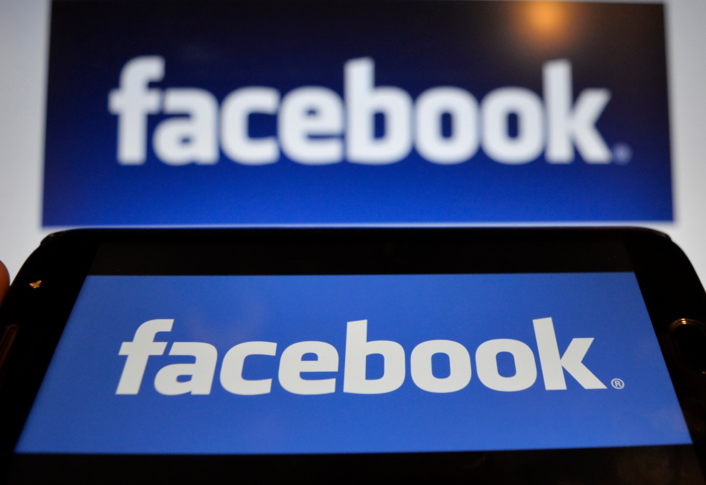 In this photo illustration a Facebook logo can be seen on a mobile screen as well as on a laptop screen, Kolkata, India, 16 August, 2019.Facebook users sues the world's largest social media network over a 2018 data breach which failed to warn data risks tied to its single sign-on tools even though it protected its employees according to an Indian media report.