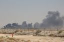 TOPSHOT - Smoke billows from an Aramco oil facility in Abqaiq about 60km (37 miles) southwest of Dhahran in Saudi Arabia's eastern province on September 14, 2019. - Drone attacks sparked fires at two Saudi Aramco oil facilities early today, the interior ministry said, in the latest assault on the state-owned energy giant as it prepares for a much-anticipated stock listing. Yemen's Iran-aligned Huthi rebels claimed the drone attacks, according to the group's Al-Masirah television. (Photo by - / AFP) (Photo credit should read -/AFP/Getty Images)