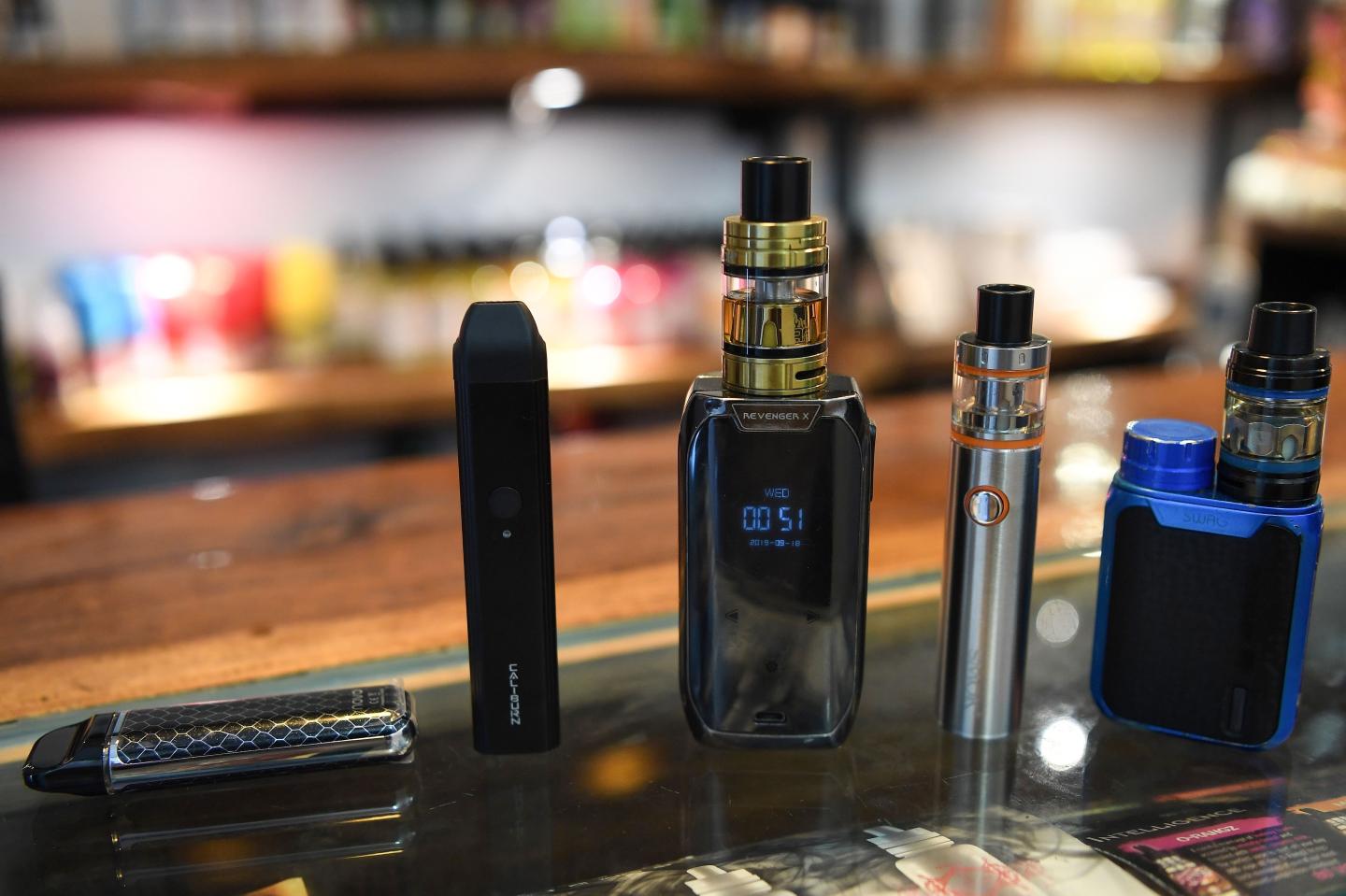 Electronic cigarette devices are pictured on display at a vaping shop in New Delhi on September 18, 2019. - India banned on September 18 the sale of electronic cigarettes, as a backlash gathers pace worldwide due to health concerns about a product promoted as less harmful than smoking tobacco. (Photo by Prakash SINGH / AFP) (Photo credit should read PRAKASH SINGH/AFP/Getty Images)