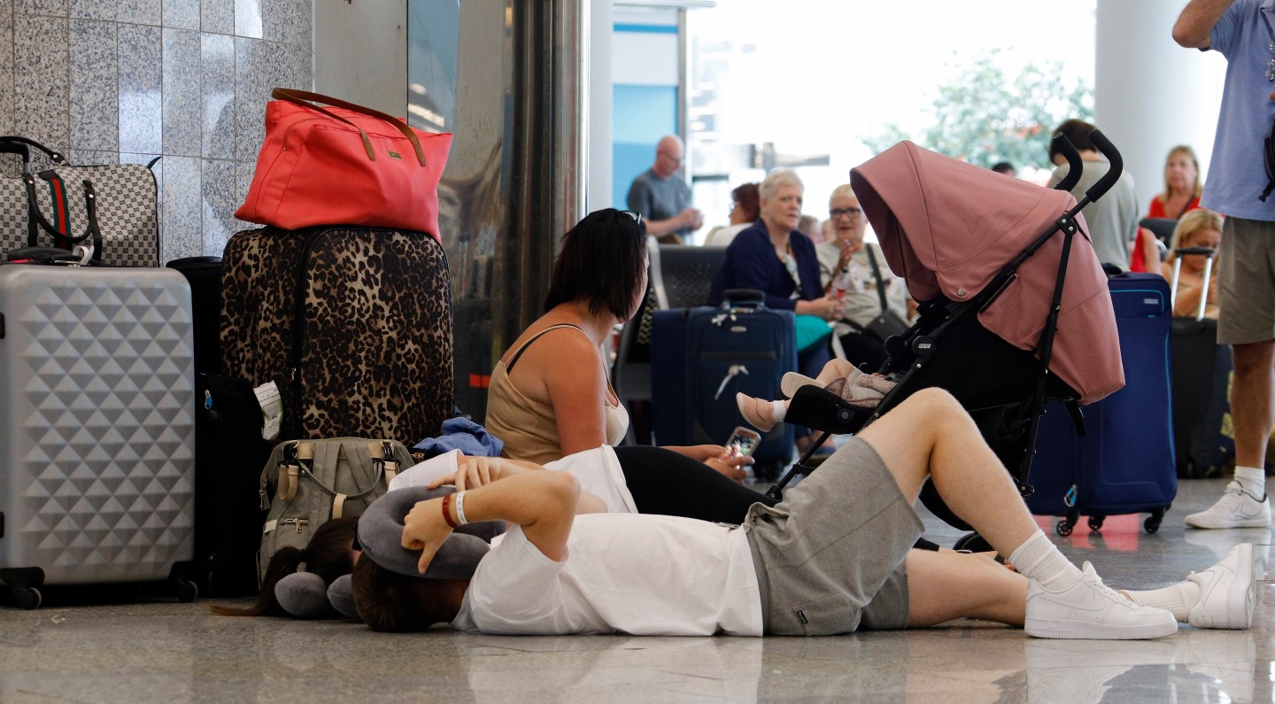 23 September 2019, Spain, Palma: On the day of the insolvency of the British travel group Thomas Cook, passengers wait at Palma de Mallorca Airport for their onward journey.