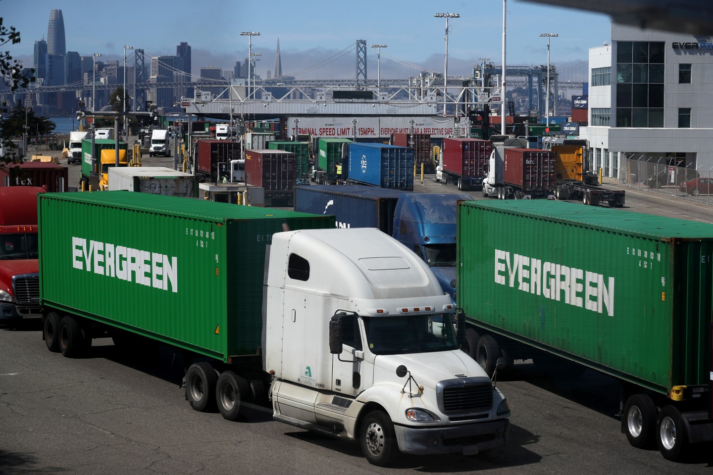 OAKLAND, CALIFORNIA - SEPTEMBER 03: Trucks move containers in and out of the Ben E. Nutter terminal at the Port of Oakland on September 03, 2019 in Oakland, California. The Dow Jones Industrial Average fell nearly 300 points on Tuesday as the United States imposed 15% tariffs on some Chinese goods this past Sunday and China also imposed new charges on products from the United States. (Photo by Justin Sullivan/Getty Images)
