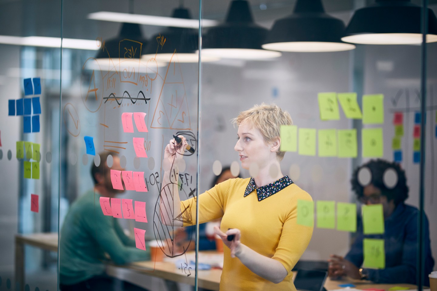 Work colleagues brainstorming in creative office