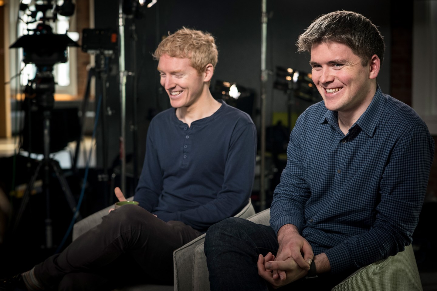 John and Patrick Collison sit next to each other.