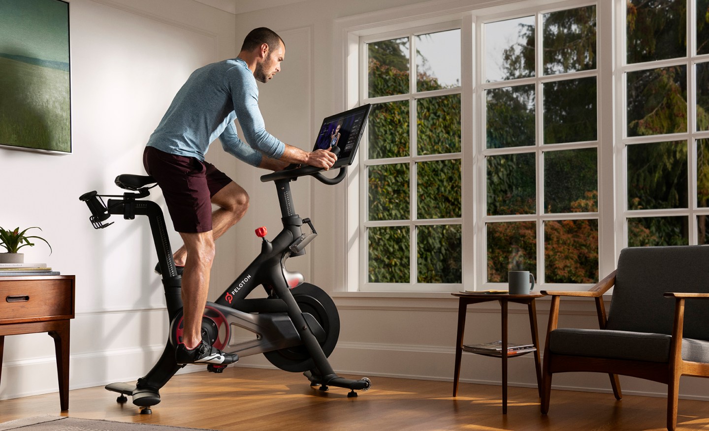 man on peloton stationary bike