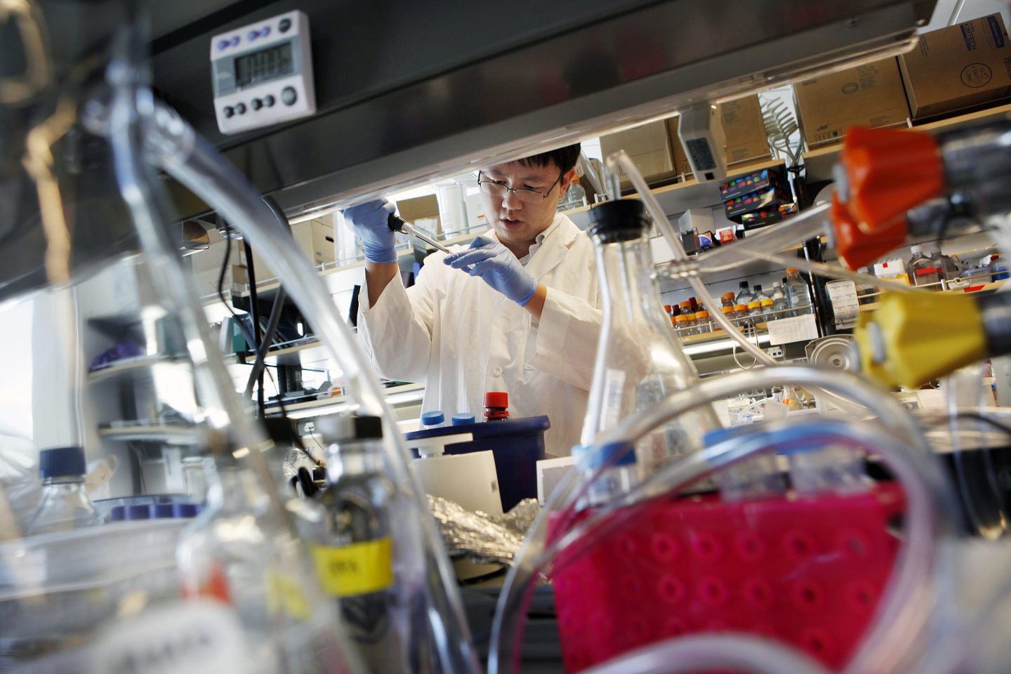 Yu Jie Tang, a post-doctoral researcher in brain tumor cancer biology extracts protein from a tumor cell line in the Monje Lab at Stanford University's Lorry I. Lokey Stem Cell Research Building, in Palo Alto, Calif. on Friday, August 31, 2012. (LiPo Chi
