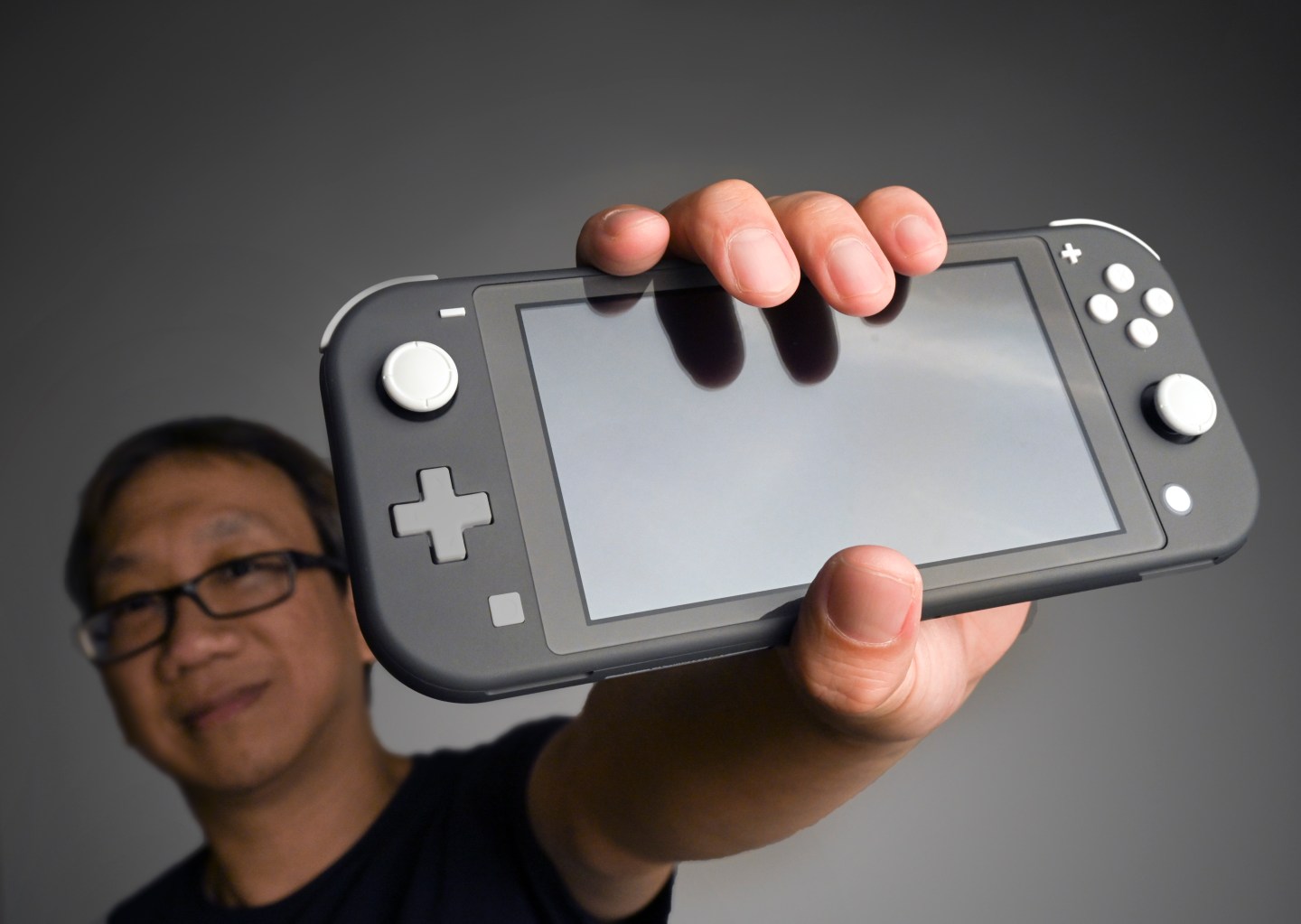 Reporter Gene Wang and the new Nintendo Switch gameplayer, on September 18 in Washington, DC.