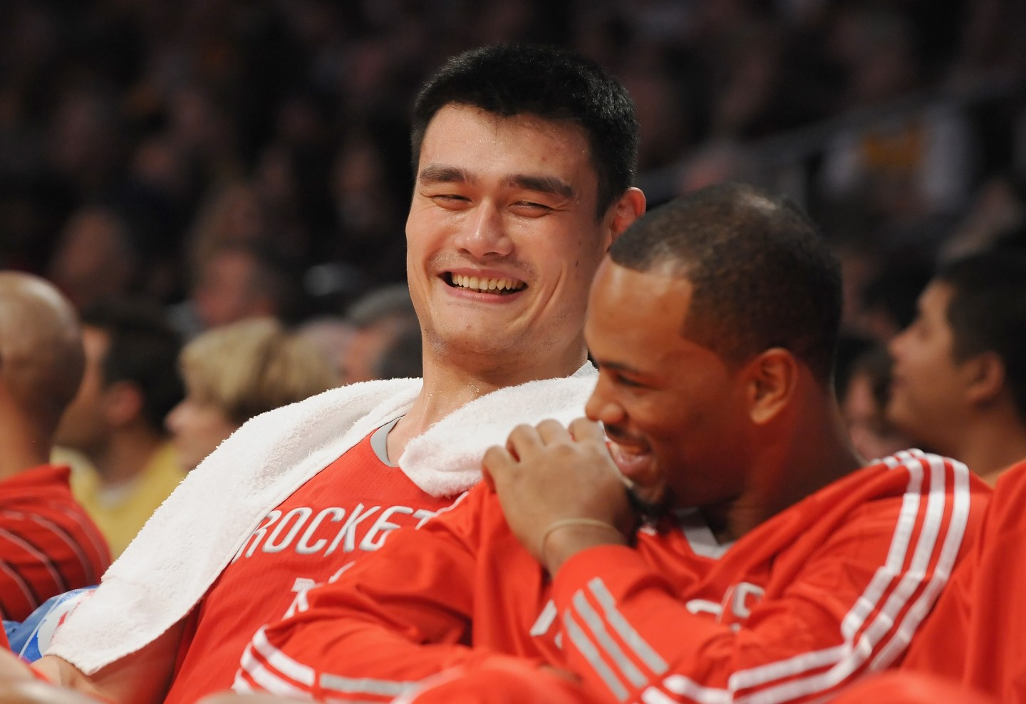 Yao Ming #11 talks with teammate Chuck Hayes #44 of the Houston Rockets on the bench during the game against the Los Angeles Lakers at the Staples Center on October 26, 2010 in Los Angeles, California.
