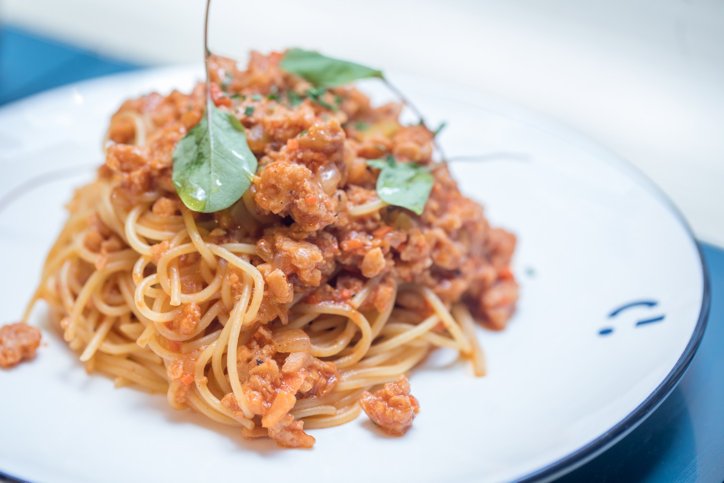 A dish of spaghetti Bolognese made with plant-based omnipork is arranged for a photograph at the Kind Kitchen restaurant, operated by Green Monday, in Hong Kong, China, on Thursday, June 20, 2019. After its success distributing Beyond Meat Inc.'s mock beef patties in Asia, start-up Green Monday has a new food challenge: convince Chinese consumers to try its lab-grown meatless pork. Photographer: Paul Yeung/Bloomberg via Getty Images