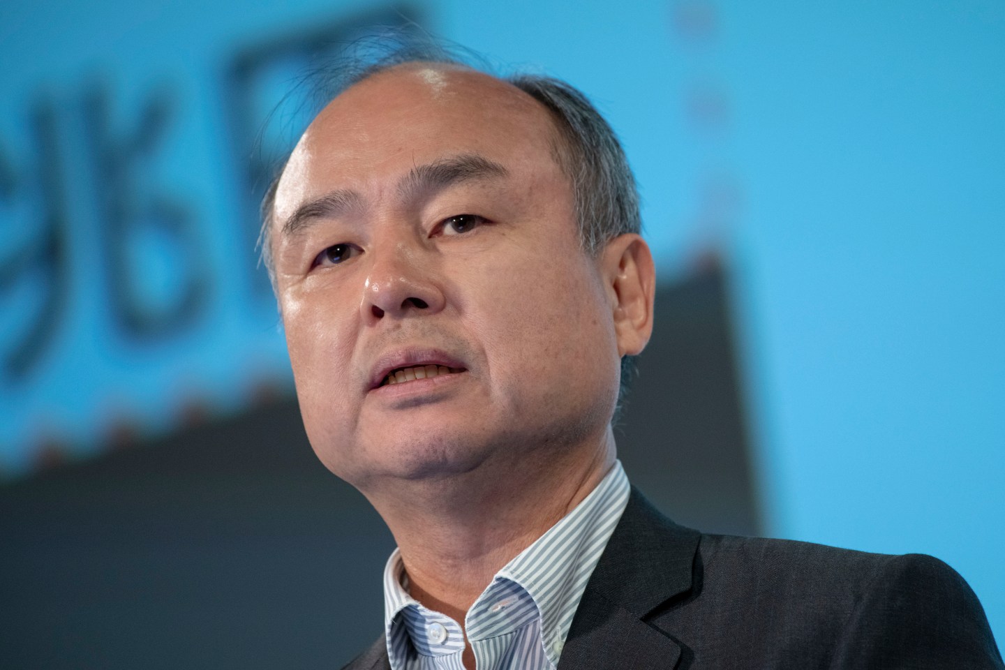 Masayoshi Son, chairman and chief executive officer of SoftBank Group Corp., speaks during a news conference in Tokyo, Japan, on Wednesday, Aug. 7, 2019. SoftBank reported first-quarter profit that beat the highest analyst estimate thanks to valuation gains from Vision Fund investments such as Slack Technologies Inc. (Photo by Alessandro Di Ciommo/NurPhoto via Getty Images)