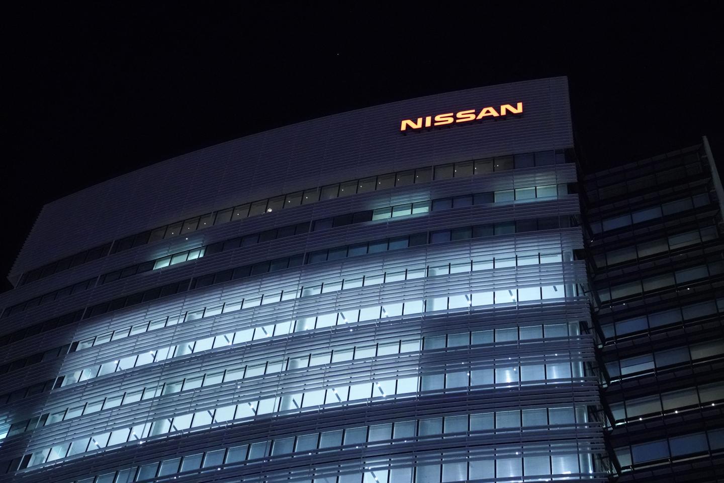 Lights illuminate offices at the Nissan Motor Co. in Yokohama, Japan, on Monday, Sept. 9, 2019. Nissan Motor Co. Chief Executive Officer Hiroto Saikawa will step down over a scandal involving inflated stock-linked bonuses, deepening the turmoil thats enveloped the Japanese automaker since the arrest of former Chairman Carlos Ghosn. Photographer: Toru Hanai/Bloomberg via Getty Images