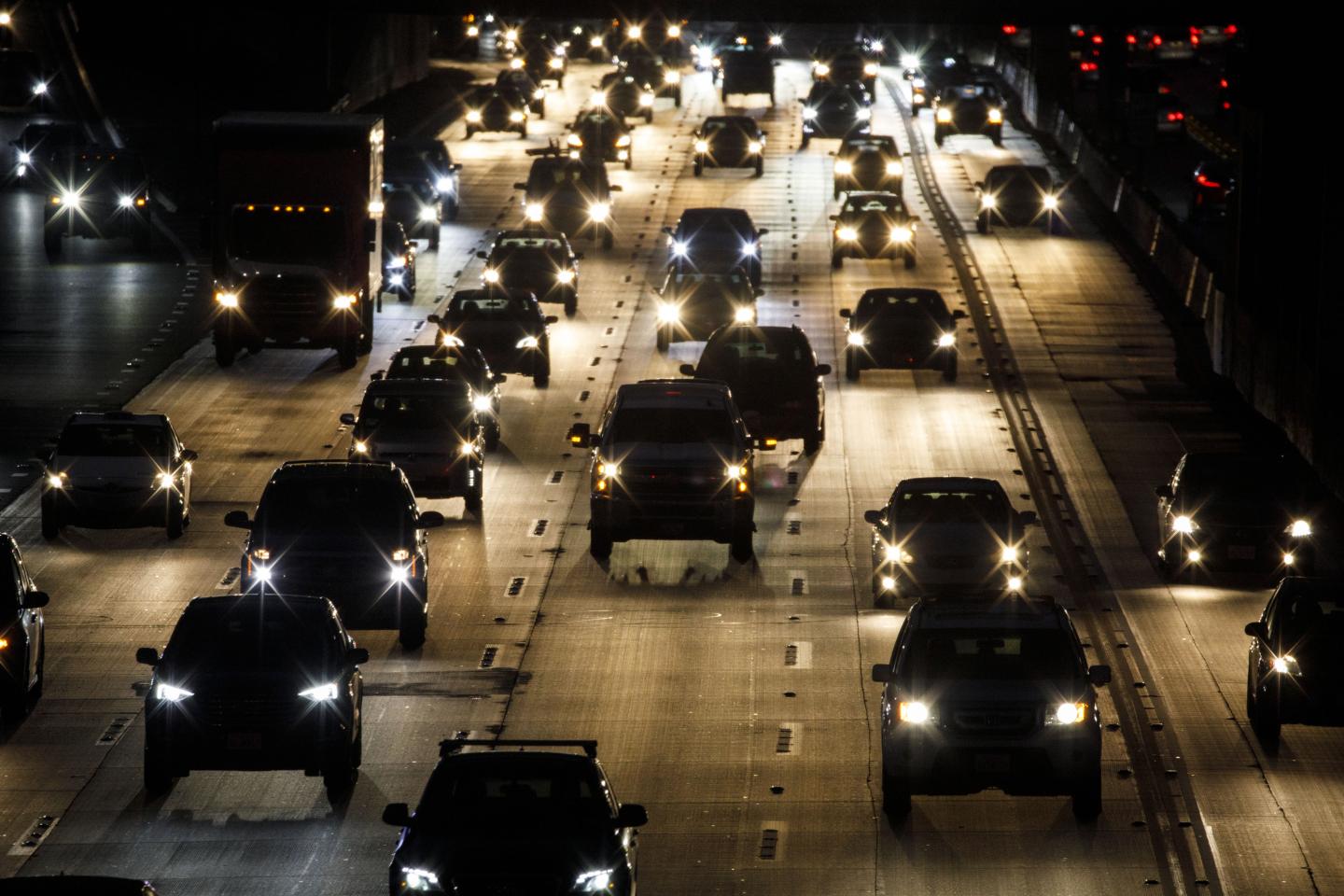 Vehicles drive in traffic down the 405 freeway at night in Inglewood, California, U.S., on Thursday, Sept. 19, 2019. The Trump administration moved to strip California of its authority to limit greenhouse gas emissions from vehicles, even as it warned the state it needs to do more to combat smog. Photographer: Patrick T. Fallon/Bloomberg via Getty Images