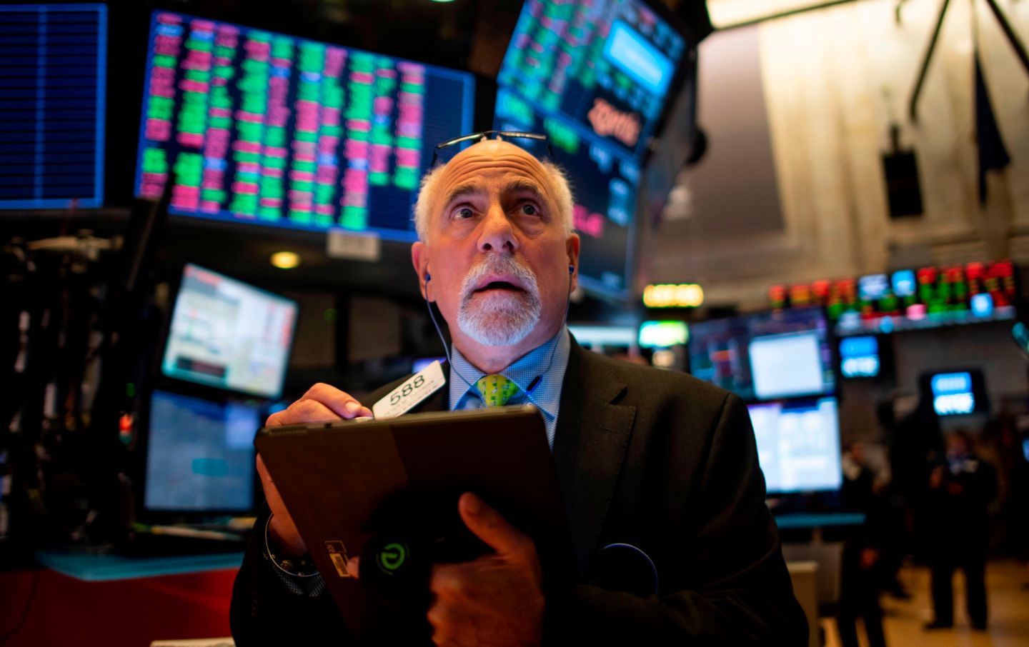 Traders work before the closing bell at the New York Stock Exchange