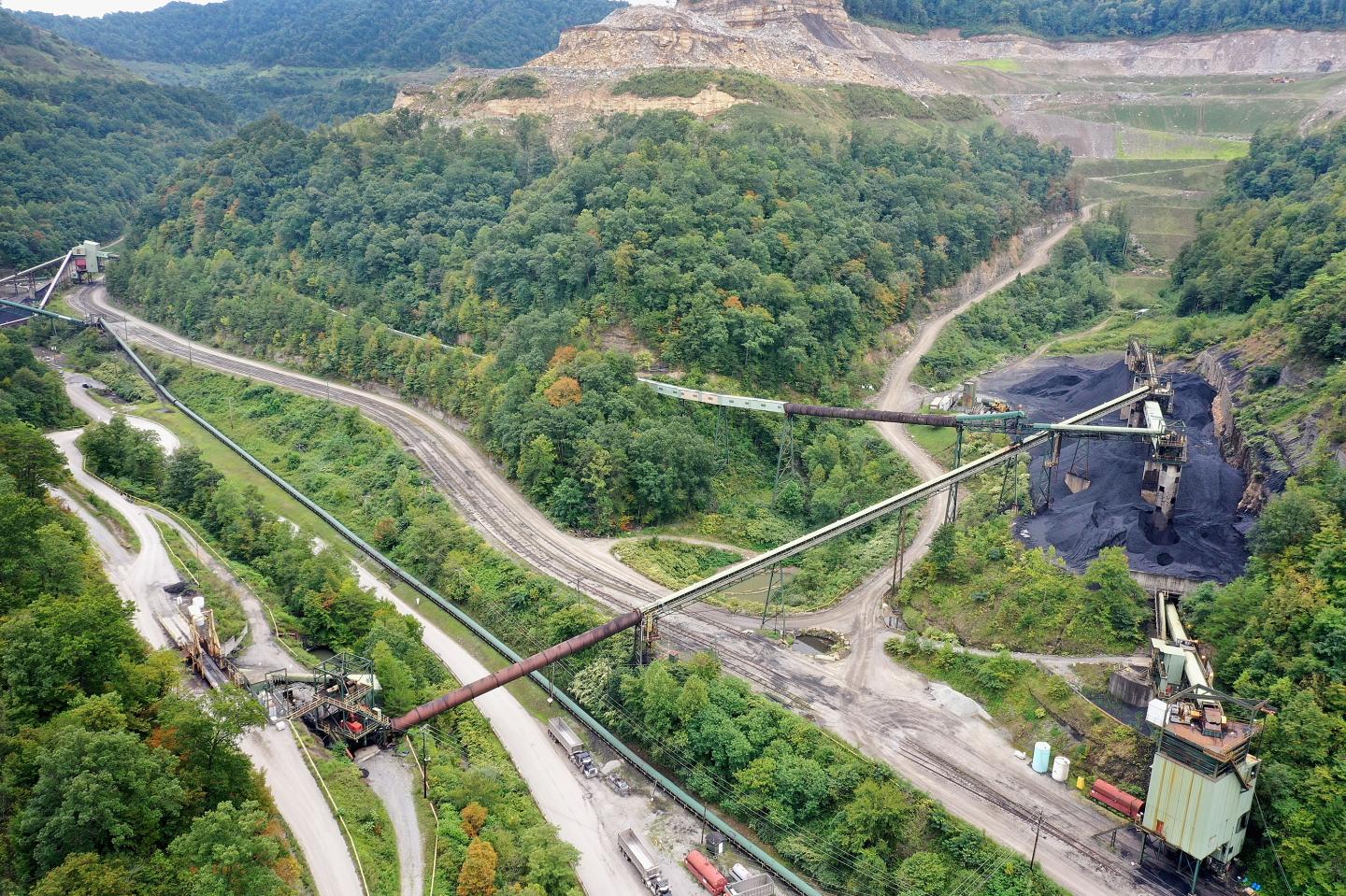 Coal is mined from a mountainside at a strip mine operation
