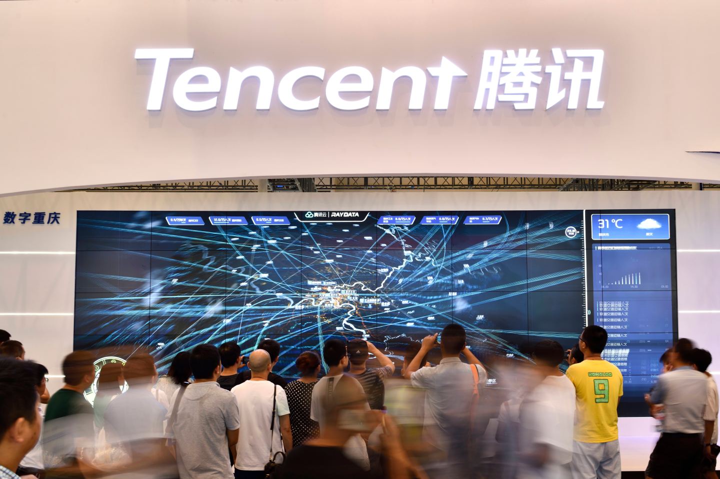 CHONGQING, CHINA - AUGUST 27: Citizens visit Tencent booth on day two of 2019 Smart China Expo at Chongqing International Expo Center on August 27, 2019 in Chongqing, China. 2019 Smart China Expo is held from August 26 to 29 in Chongqing. (Photo by VCG/VCG via Getty Images)