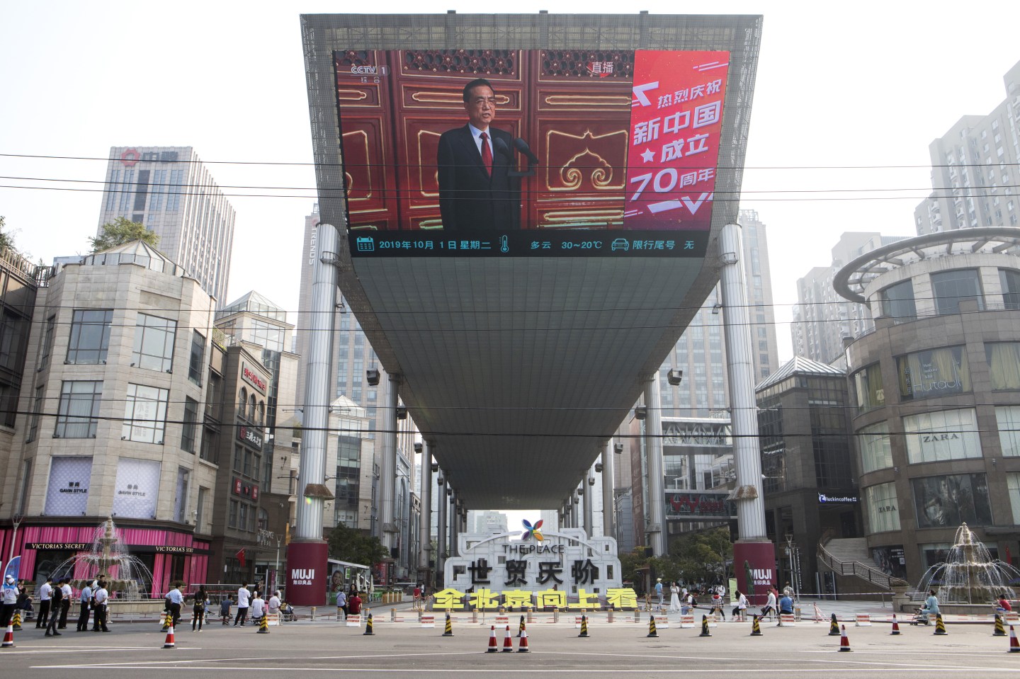 A screen shows a live broadcast of Chinese Premier Li Keqiang attending the military parade for the 70th anniversary of the People's Republic of China in Beijing, China, on Tuesday, Oct. 1, 2019. President Xi Jinping declared that no force could stop Chinas rise, exuding confidence during a key anniversary as he faced unprecedented challenges from protesters in Hong Kong and Donald Trumps trade war. Photographer: Giulia Marchi/Bloomberg via Getty Images