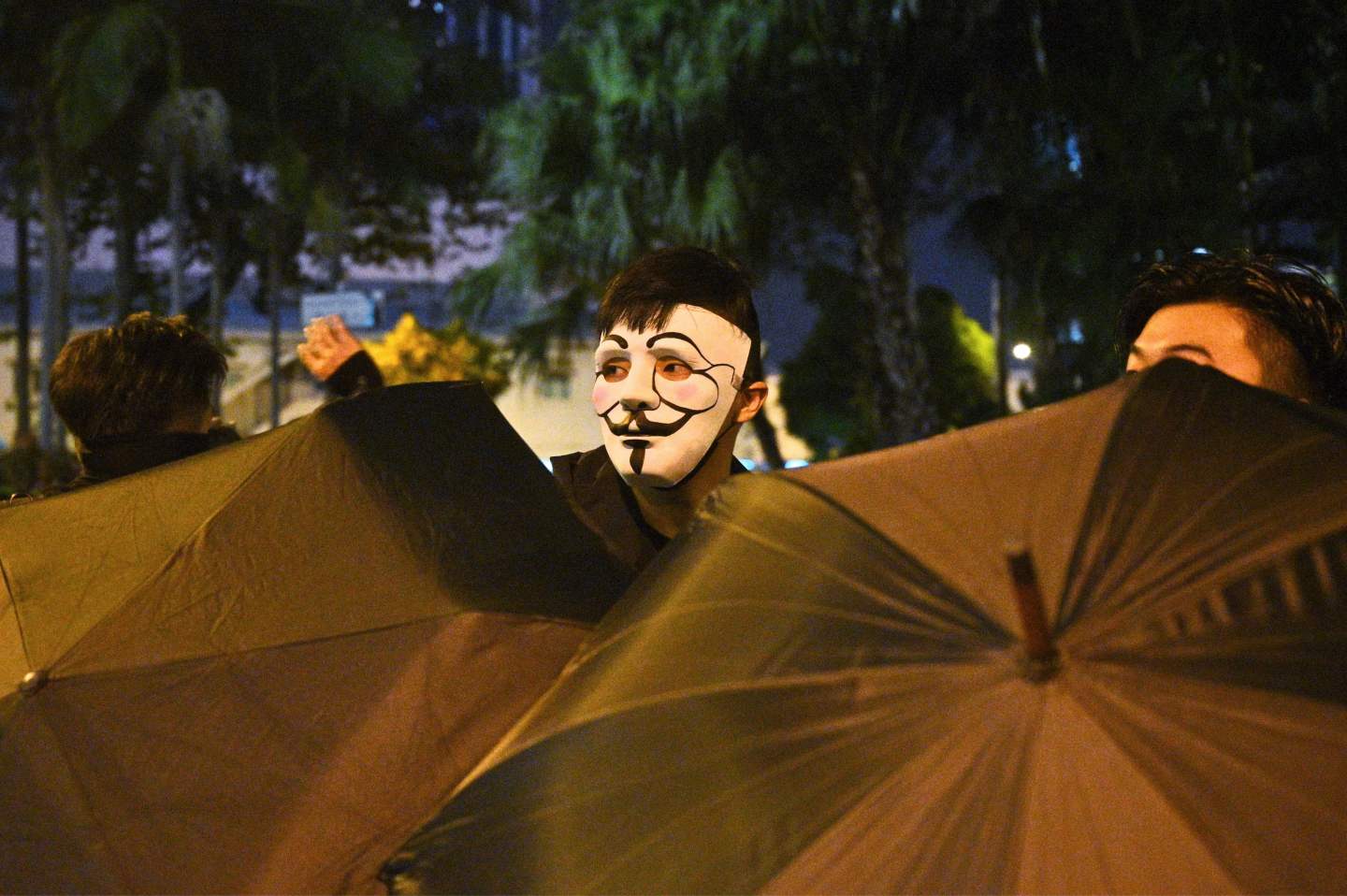 A protester wearing a mask takes part in a protest in the Wanchai district in Hong Kong on October 4, 2019, after people hit the streets when the government earlier announced a ban on facemasks. - Hong Kong's leader on October 4 invoked a rarely used colonial-era emergency law to ban people from wearing face masks in a bid to put an end to months of violent protests. (Photo by Philip FONG / AFP) (Photo by PHILIP FONG/AFP via Getty Images)
