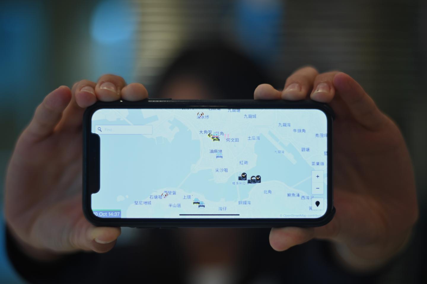 This photo illustration shows a smartphone displaying the "HKmap.live" app in Hong Kong on October 10, 2019. - Apple on October 10 removed an app criticised by China for allowing protesters in Hong Kong to track police, as Beijing steps up pressure on foreign companies deemed to be providing support to the pro-democracy movement. (Photo by Philip FONG / AFP) (Photo by PHILIP FONG/AFP via Getty Images)
