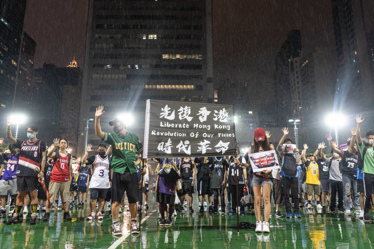 WAN CHAI, HONG KONG - 2019/10/15: Protesters holding a black banner at the court, during the demonstration. Hundreds of protesters gathered to express their anger about Lebron James's tweet and to show support to the General Manager of the Houston Rockets, Daryl Morey, and Adam Silver, Commissioner of the NBA, for defending freedom as a core value in NBA. (Photo by Ivan Cheung/SOPA Images/LightRocket via Getty Images)