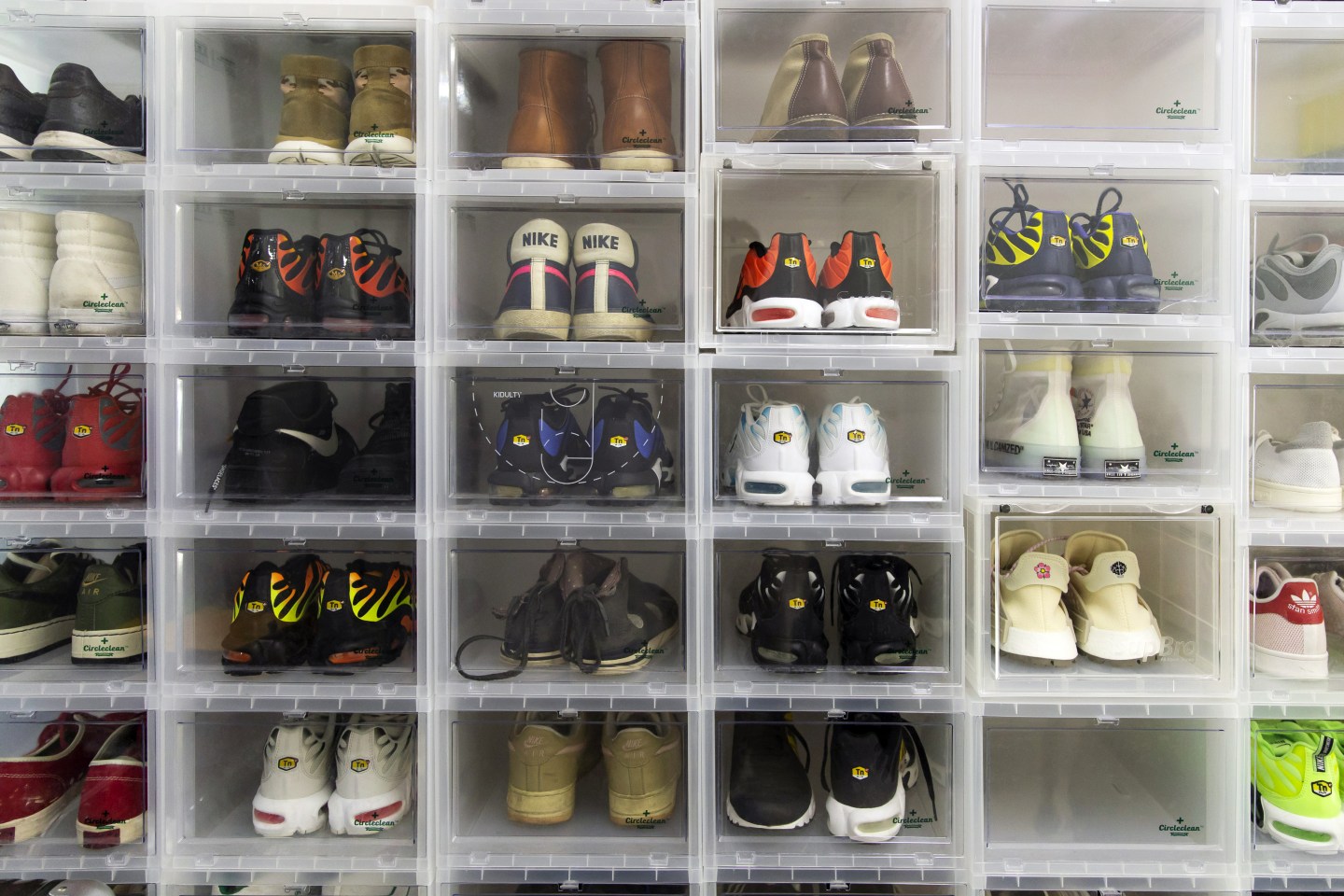 Sneakers sit in stacked clear boxes at the office of Nice, an online sneaker trading platform, in Beijing, China, on Wednesday, Sept. 25, 2019. Across China, more than 10 million monthly active users frequent online-resale apps for sneakers, such as Poizon, Nice and DoNew, according to Chinese data-mining company QuestMobile. While many products suffer from the effects of the trade war, pairs of collectible sneakers are flying off the shelves, and that's attracting the attention of U.S. sneaker exchanges like StockX and GOAT. Photographer: Qilai Shen/Bloomberg via Getty Images