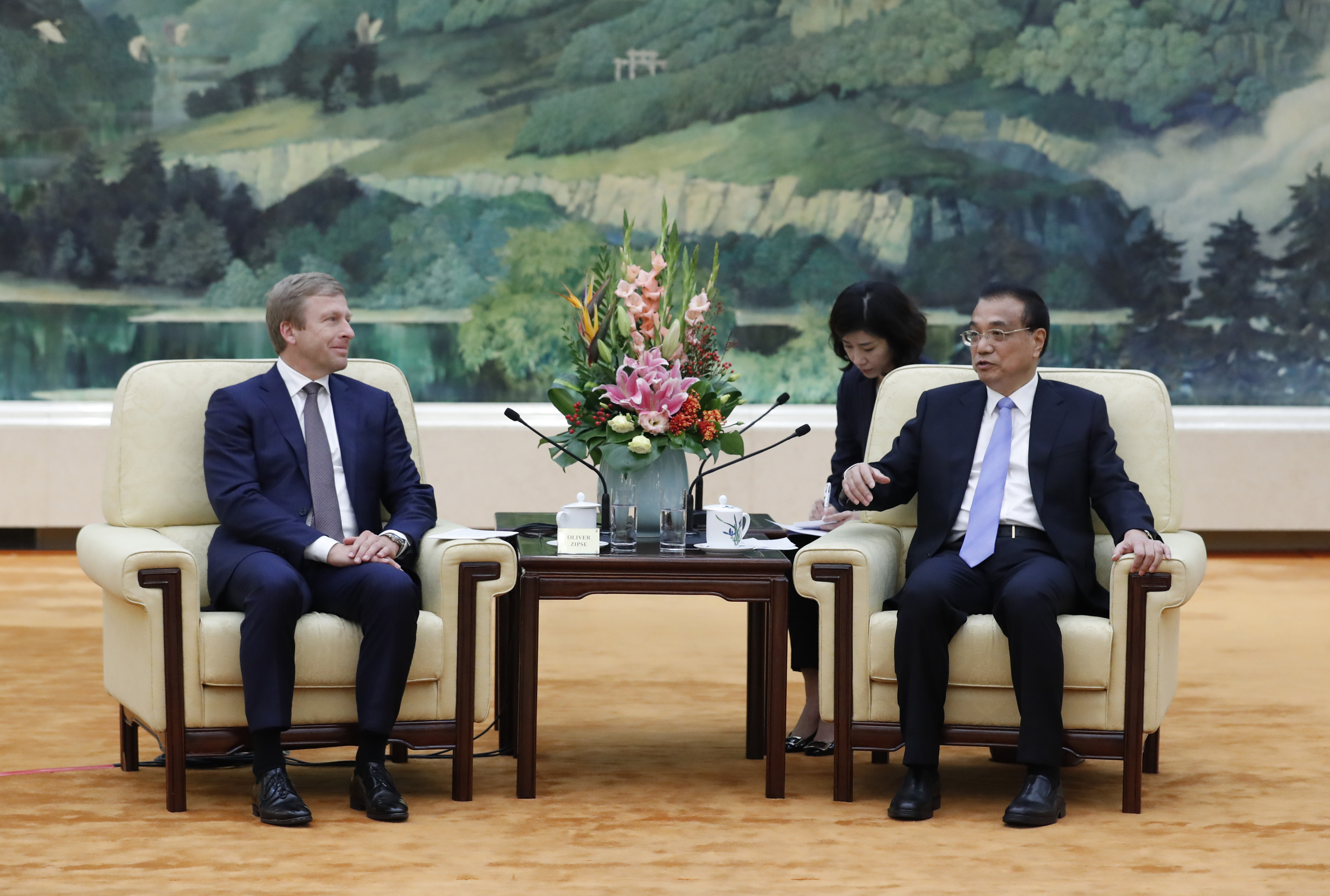 Chinese Premier Li Keqiang (R) meets with Oliver Zipse, chairman of the management board of BMW Group, at the Great Hall of the People in Beijing on October 18, 2019. (Photo by Yukie Nishizawa / POOL / AFP) / The erroneous mention[s] appearing in the metadata of this photo by Yukie Nishizawa has been modified in AFP systems in the following manner: removes reference to [China-Advanced Manufacturing Advisory Council meeting ] in caption, and modifies slug to include [BMW] . Please immediately remove the erroneous mention[s] from all your online services and delete it (them) from your servers. If you have been authorized by AFP to distribute it (them) to third parties, please ensure that the same actions are carried out by them. Failure to promptly comply with these instructions will entail liability on your part for any continued or post notification usage. Therefore we thank you very much for all your attention and prompt action. We are sorry for the inconvenience this notification may cause and remain at your disposal for any further information you may require. (Photo by YUKIE NISHIZAWA/POOL/AFP via Getty Images)
