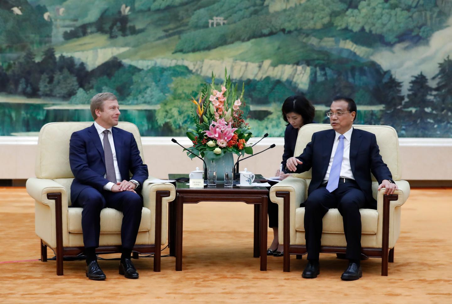Chinese Premier Li Keqiang (R) meets with Oliver Zipse, chairman of the management board of BMW Group, at the Great Hall of the People in Beijing on October 18, 2019. (Photo by Yukie Nishizawa / POOL / AFP) / The erroneous mention[s] appearing in the metadata of this photo by Yukie Nishizawa has been modified in AFP systems in the following manner: removes reference to [China-Advanced Manufacturing Advisory Council meeting ] in caption, and modifies slug to include [BMW] . Please immediately remove the erroneous mention[s] from all your online services and delete it (them) from your servers. If you have been authorized by AFP to distribute it (them) to third parties, please ensure that the same actions are carried out by them. Failure to promptly comply with these instructions will entail liability on your part for any continued or post notification usage. Therefore we thank you very much for all your attention and prompt action. We are sorry for the inconvenience this notification may cause and remain at your disposal for any further information you may require. (Photo by YUKIE NISHIZAWA/POOL/AFP via Getty Images)