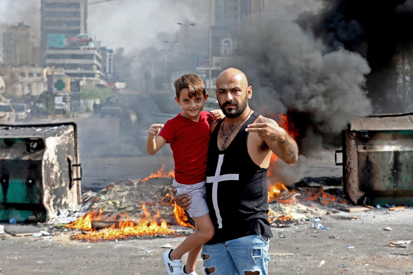 A Lebanese demonstrator poses for an picture during a protest against dire economic conditions in Baouchriyeh on the northern outskirts of Beirut, on October 18, 2019. - Public anger has simmered since parliament passed an austerity budget in July to help trim a ballooning deficit and flared on Thursday over new plans to tax calls on messaging applications such as Whatsapp, forcing the government to axe the unpopular proposal. (Photo by ANWAR AMRO / AFP) (Photo by ANWAR AMRO/AFP via Getty Images)