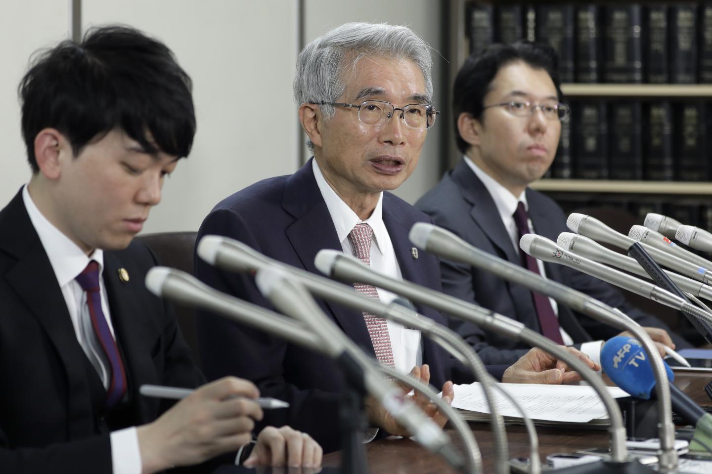 Junichiro Hironaka, a lawyer representing former Nissan Motor Co. Chairman Carlos Ghosn, center, speaks during a news conference in Tokyo, Japan, on Thursday, Oct. 24, 2019. Ghosn's lawyers entered pleas of not guilty on all charges against him, saying he is the victim of a conspiracy between prosecutors, the government and the automaker to bring about his downfall. Photographer: Kiyoshi Ota/Bloomberg via Getty Images