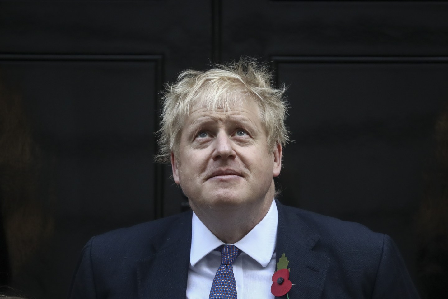 Boris Johnson, U.K. prime minister, stands on the steps outside number 10 Downing Street during a promotional photo opportunity for the Royal British Legion's annual Poppy Appeal campaign in London, U.K., on Monday, Oct. 28, 2019.