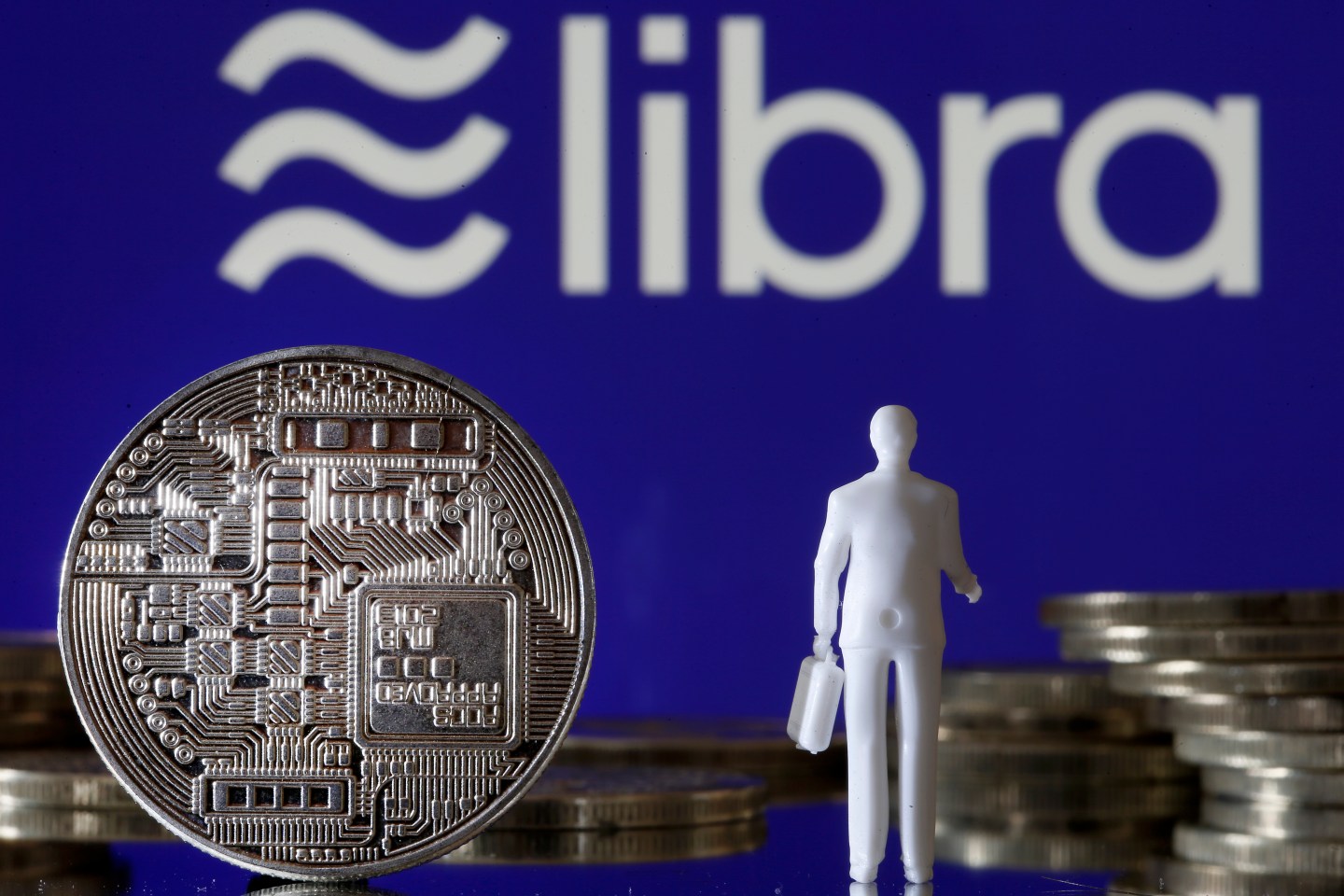 PARIS, FRANCE - OCTOBER 21: In this photo illustration, a visual representation of digital cryptocurrency coins sit on display in front of a Libra logo on October 21, 2019 in Paris, France. Several European countries, including France, are preparing to veto the virtual currency project Libra, dangerous for the global economy, according to the French Minister of Economy, Bruno Le Maire. Libra is a cryptocurrency and virtual currency project initiated by Facebook that includes a consortium of twenty-one major corporations and international NGOs. (Photo by Chesnot/Getty Images)