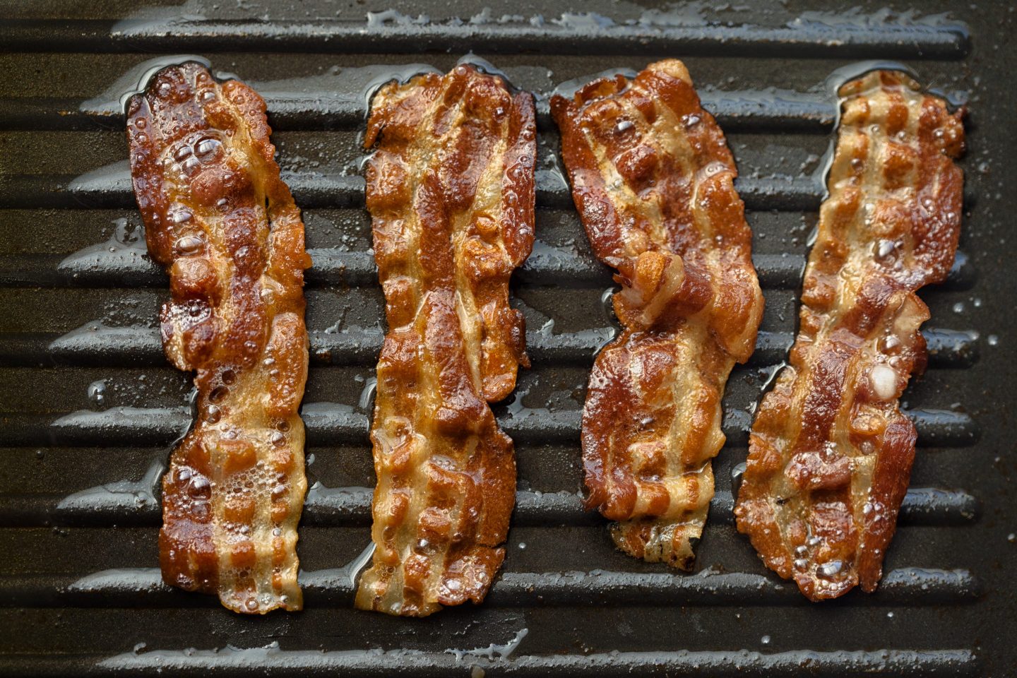 Bacon frying on grill
