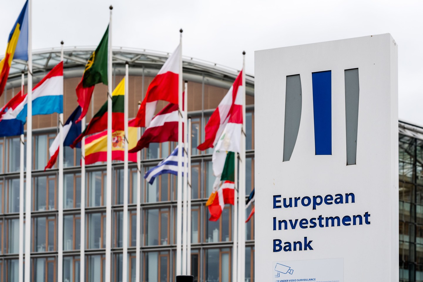 Flags of European Union (EU) member state fly outside the European Investment Bank in Luxembourg, on Monday, July 15, 2019. Brexit has made Luxembourg a favorite EU hub for insurers, funds and asset managers to relocate to from the U.K. Moves include those by insurance giant American International Group Inc., private-equity firm Blackstone, RSA Insurance Group Plc, U.S. insurer FM Global, Lloyd's of London insurer Hiscox Plc and asset manager M&G Investments. Photographer: Geert Vanden Wijngaert/Bloomberg via Getty Images
