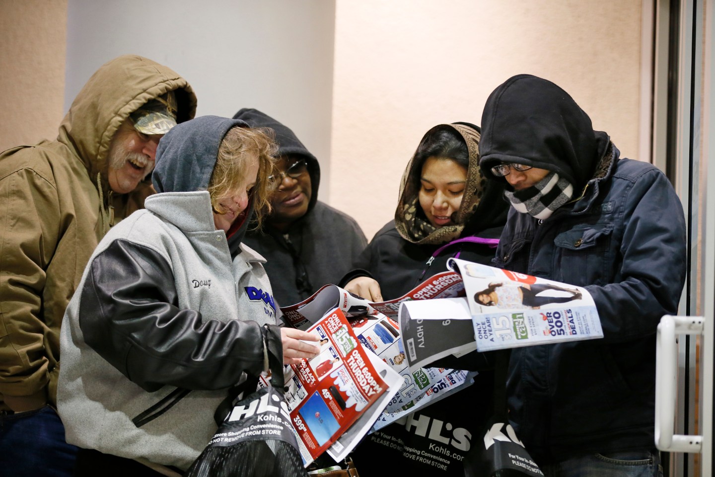 Black Friday shoppers looked at sale items while they waited for Kohls to open