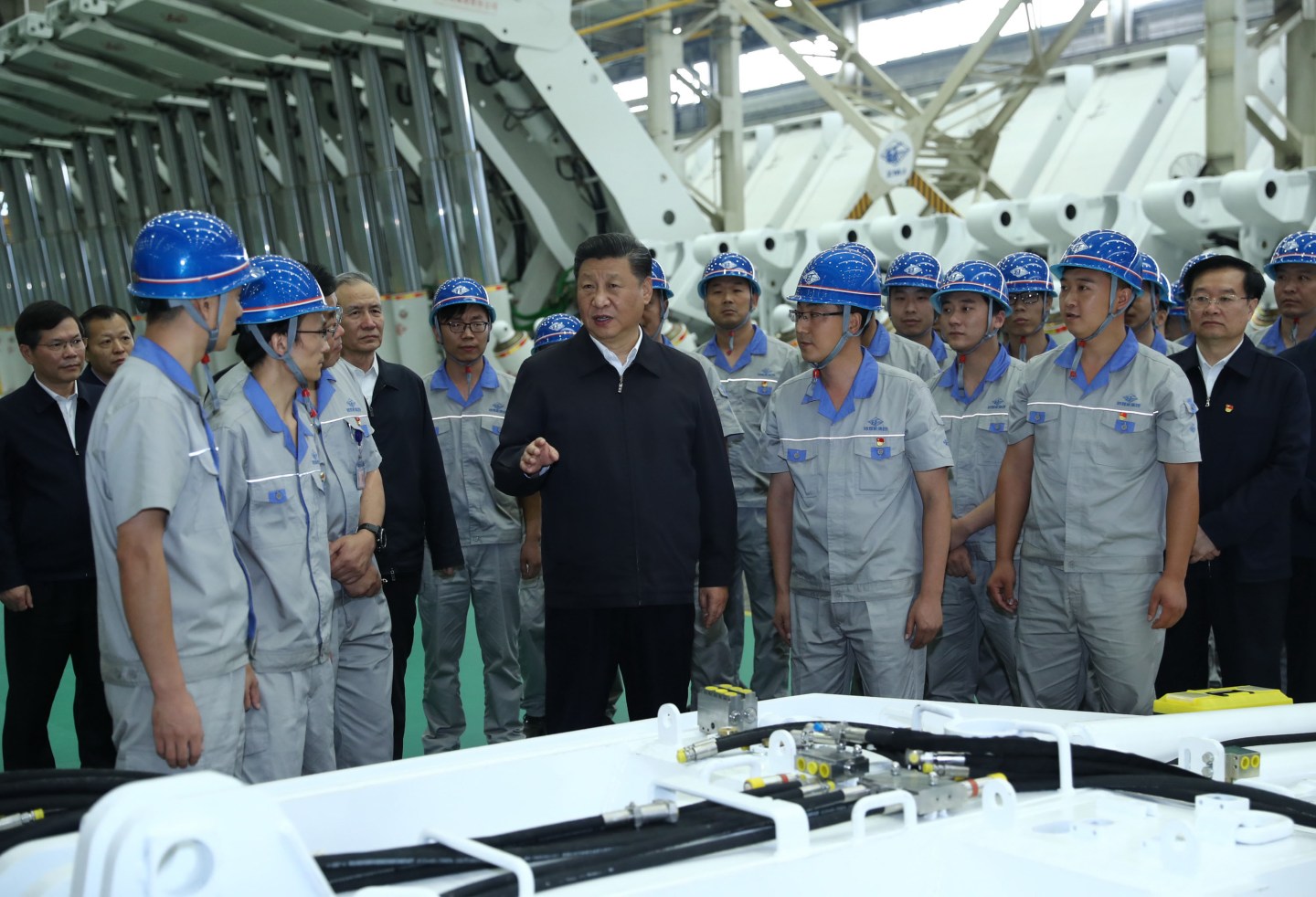 ZHENGZHOU, Sept. 17, 2019 -- Chinese President Xi Jinping, also general secretary of the Communist Party of China Central Committee and chairman of the Central Military Commission, communicates with workers while inspecting Zhengzhou Coal Mining Machinery Group Co., Ltd. during his tour in Zhengzhou, central China's Henan Province, Sept. 17, 2019. (Photo by Ju Peng/Xinhua via Getty)