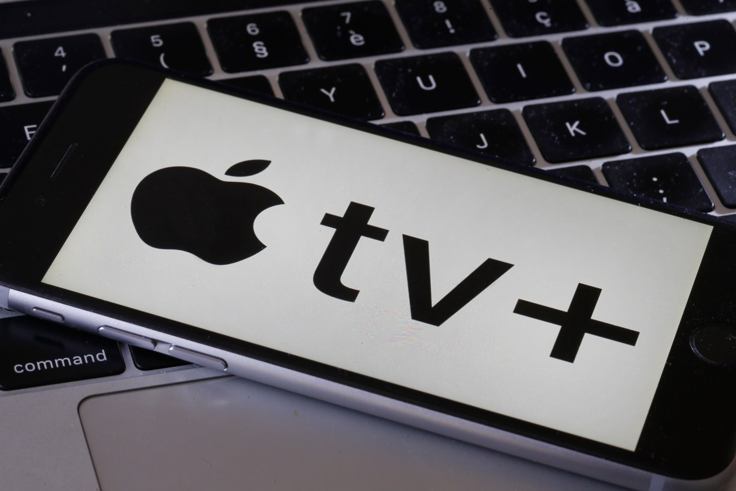 PARIS, FRANCE - SEPTEMBER 11: In this photo illustration, the Apple TV Plus logo is displayed on an iPhone screen on September 11, 2019 in Paris, France. Yesterday, the US multinational Apple announced at its keynote launch its video on demand web television entitled Apple TV Plus. video streaming service Apple TV + will be available from November 1, 2019 in France and in a hundred countries at a rate of 4.99 euros per month.