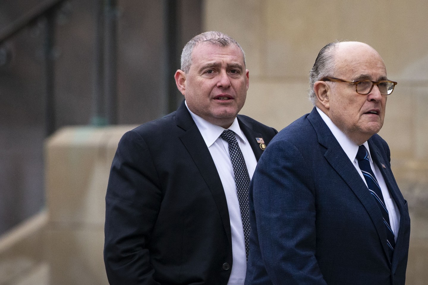 FILE PHOTO: Rudy Giuliani, former mayor of New York, arrives with his associate Lev Parnas, left, before a state funeral service for former President George H.W. Bush at the National Cathedral in Washington, D.C., U.S., on Wednesday, Dec. 5, 2018. Parnas and Igor Fruman, Ukraine-born allies of Giuliani, were accused by U.S. prosecutors of skirting campaign contribution limits as part of a plot to oust the American ambassador to Ukraine, an episode now under scrutiny by a congressional committee weighing the impeachment of President Donald Trump. Photographer: Al Drago/Bloomberg via Getty Images